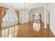 Spacious living room featuring hardwood floors, large windows, and elegant chandelier at 1250 Parkview Nw Ln, Kennesaw, GA 30152