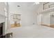 Spacious living room with fireplace, adjacent to a bright, white kitchen at 1250 Parkview Nw Ln, Kennesaw, GA 30152