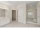 Neutral-toned bathroom with white cabinets, glass enclosed shower, and a large vanity at 1250 Parkview Nw Ln, Kennesaw, GA 30152