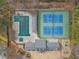 Aerial view showcasing pool, tennis courts, clubhouse, and playground in a well-planned community layout at 1508 Walker Ridge Sw Dr, Marietta, GA 30064