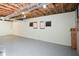 Spacious basement featuring an epoxy floor and exposed ceiling at 1508 Walker Ridge Sw Dr, Marietta, GA 30064