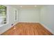 Light-filled bedroom featuring gleaming hardwood floors and neutral walls at 1508 Walker Ridge Sw Dr, Marietta, GA 30064