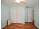 Bedroom with hardwood flooring, closet, and overhead fan at 1508 Walker Ridge Sw Dr, Marietta, GA 30064