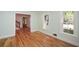 Spacious bedroom with two windows, gleaming hardwood floors, and neutral walls at 1508 Walker Ridge Sw Dr, Marietta, GA 30064