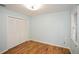 Bedroom with wood floors, an overhead light, and closet at 1508 Walker Ridge Sw Dr, Marietta, GA 30064