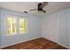 Bedroom featuring wood floors, ceiling fan, and closet at 1508 Walker Ridge Sw Dr, Marietta, GA 30064