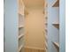 Spacious walk-in closet with shelving and rods for storage at 1508 Walker Ridge Sw Dr, Marietta, GA 30064