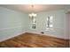 Charming dining room with hardwood floors, classic trim and a chandelier at 1508 Walker Ridge Sw Dr, Marietta, GA 30064