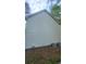 View of the side of this home with the exterior featuring horizontal siding and two AC units at 1508 Walker Ridge Sw Dr, Marietta, GA 30064