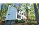 Well-maintained exterior with lush landscaping and a three-car garage, showcasing curb appeal and functionality at 1508 Walker Ridge Sw Dr, Marietta, GA 30064