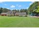 Exterior view of the community clubhouse, playground, and sprawling green lawn offering a picturesque setting at 1508 Walker Ridge Sw Dr, Marietta, GA 30064