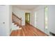 Bright foyer with hardwood floors, staircase, and a glass-lined front door at 1508 Walker Ridge Sw Dr, Marietta, GA 30064