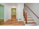 Entry hall with hardwood floors, a staircase, and a view of the dining room at 1508 Walker Ridge Sw Dr, Marietta, GA 30064