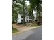 Charming home with lush greenery, flag pole, and inviting curb appeal at 1508 Walker Ridge Sw Dr, Marietta, GA 30064