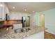 Bright kitchen with granite countertops, stainless appliances, and hardwood floors at 1508 Walker Ridge Sw Dr, Marietta, GA 30064