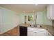 Eat-in kitchen featuring granite countertops, hardwood floors, and a window view at 1508 Walker Ridge Sw Dr, Marietta, GA 30064