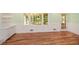 Open living room boasts hardwood floors, large windows and classic white trim at 1508 Walker Ridge Sw Dr, Marietta, GA 30064