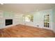 Spacious living room with hardwood floors, built-in bookshelves, and fireplace at 1508 Walker Ridge Sw Dr, Marietta, GA 30064
