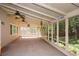 Inviting screened porch with ceiling fans offering a relaxing outdoor space at 1508 Walker Ridge Sw Dr, Marietta, GA 30064