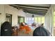 Well decorated screened porch featuring ample seating and natural light at 1508 Walker Ridge Sw Dr, Marietta, GA 30064