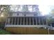 Spacious screened porch overlooking a serene backyard, perfect for outdoor entertaining and relaxation at 1508 Walker Ridge Sw Dr, Marietta, GA 30064