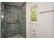 Luxurious walk-in shower with rainfall shower head, bench and glass doors at 1508 Walker Ridge Sw Dr, Marietta, GA 30064