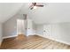 An upstairs bedroom featuring plank flooring, an A-frame ceiling and closet access at 1701 Aircraft S Dr, Marietta, GA 30060