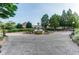 Enjoy this beautifully designed community area with a water fountain, benches, tables and lush green landscaping at 1701 Aircraft S Dr, Marietta, GA 30060
