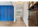 Welcoming foyer with hardwood floors and a striking blue accent wall at 1701 Aircraft S Dr, Marietta, GA 30060