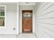 Stunning wood front door with decorative glass and sidelight at 1701 Aircraft S Dr, Marietta, GA 30060