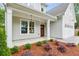 Inviting front porch with craftsman columns and lush landscaping at 1701 Aircraft S Dr, Marietta, GA 30060