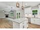 Modern kitchen features white cabinets, stainless steel appliances, granite countertops and a central island at 1701 Aircraft S Dr, Marietta, GA 30060
