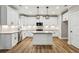 Modern kitchen with white cabinets, granite countertops, and stainless steel appliances at 1701 Aircraft S Dr, Marietta, GA 30060