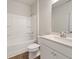 Cozy bathroom with a tub, white vanity, and wood-look floors at 321 Arwen Dr, Mcdonough, GA 30252