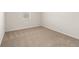This cozy bedroom has neutral carpet, window and fresh white walls at 321 Arwen Dr, Mcdonough, GA 30252