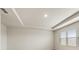 Neutral bedroom shows trey ceilings and light-filled windows at 321 Arwen Dr, Mcdonough, GA 30252