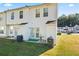 Spacious backyard with patio, manicured lawn, and residential views at 6099 Camden Forrest Cv, Riverdale, GA 30296