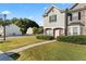 Attractive townhome with a green lawn, sidewalk and easy street access at 6099 Camden Forrest Cv, Riverdale, GA 30296