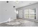 Bright living room with modern flooring and ample natural light from large window at 6099 Camden Forrest Cv, Riverdale, GA 30296