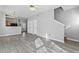Spacious open-plan living area with sleek flooring and access to the backyard at 6099 Camden Forrest Cv, Riverdale, GA 30296