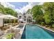 Stunning backyard with a luxurious pool, sun loungers, manicured landscaping, and an elegant outdoor living space at 132 Mount Vernon Dr, Decatur, GA 30030