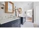 Elegant bathroom with double vanity, marble countertops, and stylish ladder towel rack at 132 Mount Vernon Dr, Decatur, GA 30030