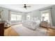 Serene bedroom with hardwood floors, neutral walls, and natural light from multiple windows at 132 Mount Vernon Dr, Decatur, GA 30030