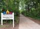 Sign for Glenlake Park in Decatur, inviting residents to enjoy nature trails and outdoor recreation at 132 Mount Vernon Dr, Decatur, GA 30030