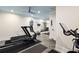 Well-equipped home gym with exercise machines, weights, and a mirrored wall for a complete workout experience at 132 Mount Vernon Dr, Decatur, GA 30030