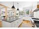Stylish kitchen featuring a large island with bar seating, stainless appliances, and bright natural light at 132 Mount Vernon Dr, Decatur, GA 30030