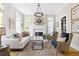 Bright living room featuring fireplace, neutral decor, hardwood floors, and ample natural light at 132 Mount Vernon Dr, Decatur, GA 30030