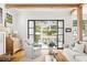 Comfortable living room with wood beams and doors to an outdoor living space at 132 Mount Vernon Dr, Decatur, GA 30030