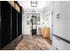 Inviting mudroom with custom storage, herringbone floor, and natural light from the front door at 132 Mount Vernon Dr, Decatur, GA 30030