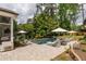 Inviting pool area with comfortable loungers, manicured gardens, and shade umbrellas perfect for relaxation at 132 Mount Vernon Dr, Decatur, GA 30030